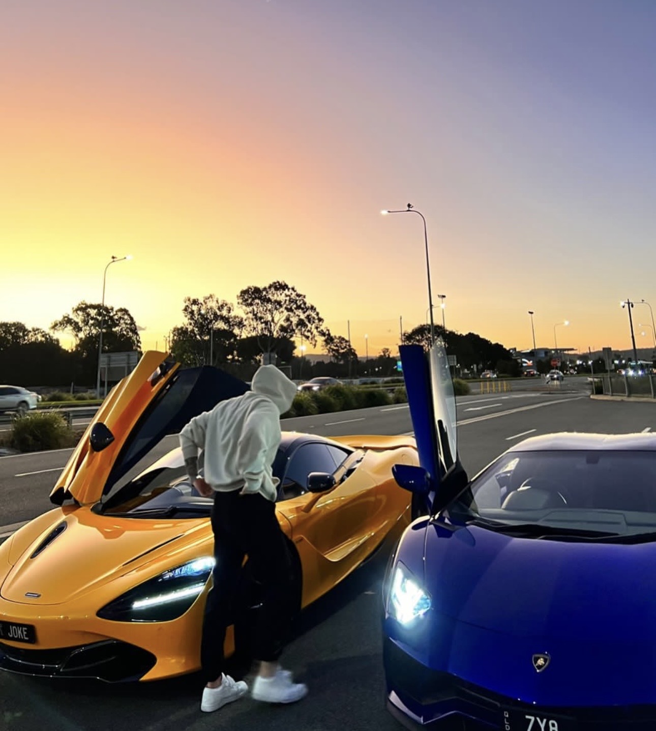 Jesse McInnes with supercars at sunset